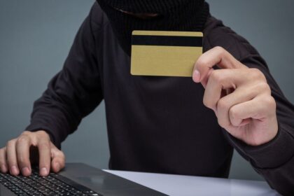 thieves hold credit cards using laptop computer password hacking activities