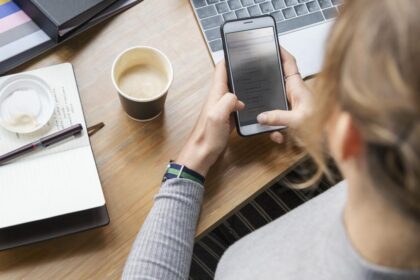 blond woman texting her phone
