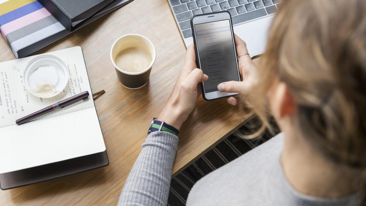blond woman texting her phone