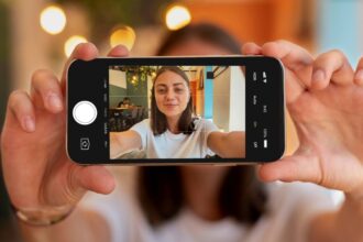 caucasian woman taking selfie with her smartphone